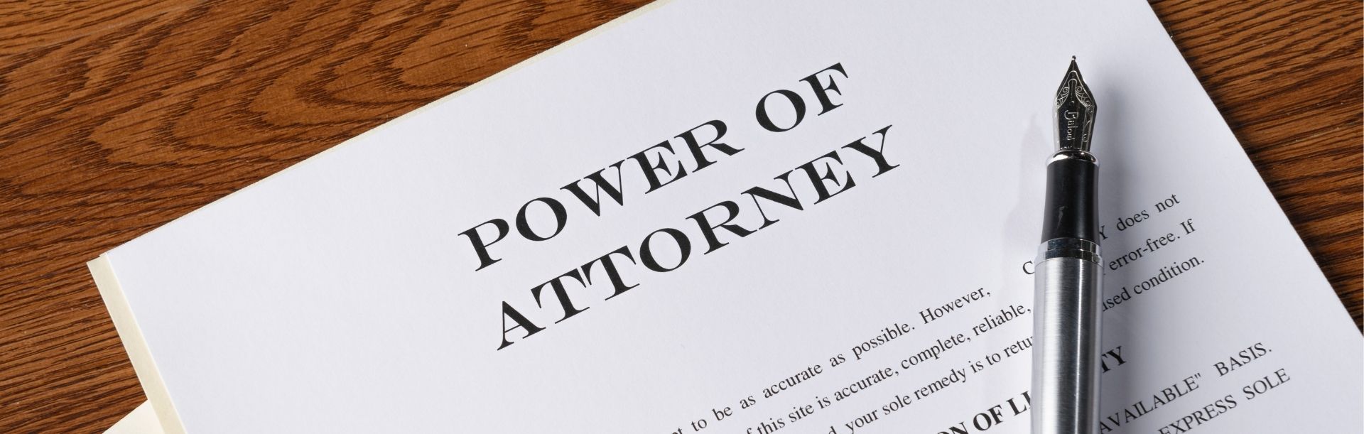 Power of Attorney documents displayed on a wooden desk